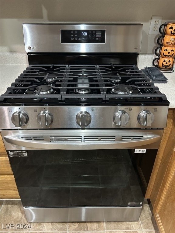 interior details with stainless steel gas range oven