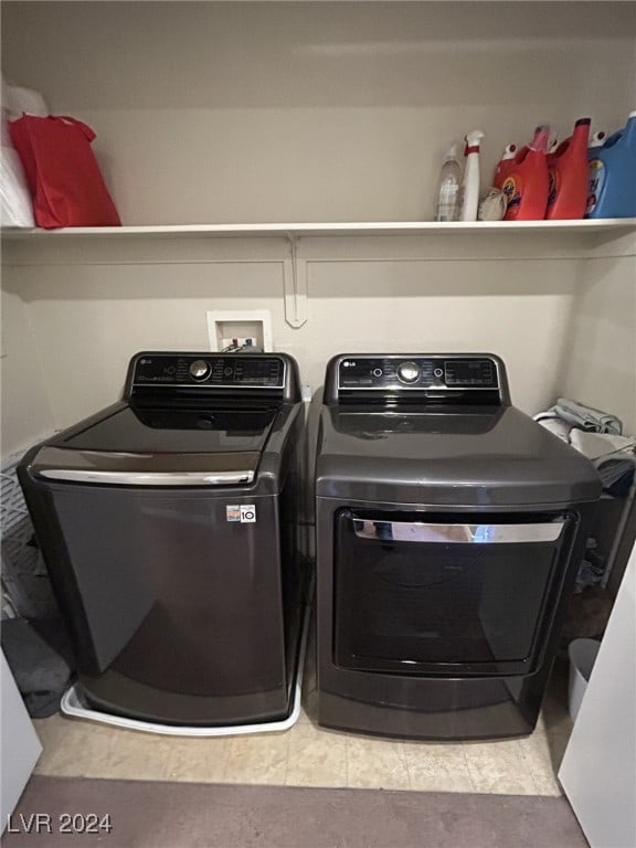 clothes washing area featuring washing machine and clothes dryer