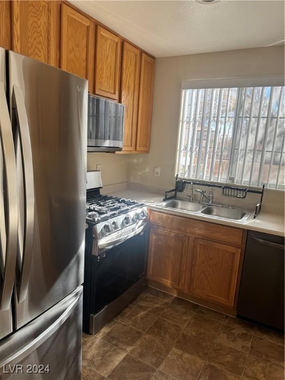 kitchen featuring appliances with stainless steel finishes and sink