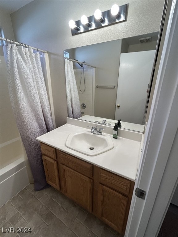 bathroom with vanity and shower / bathtub combination with curtain