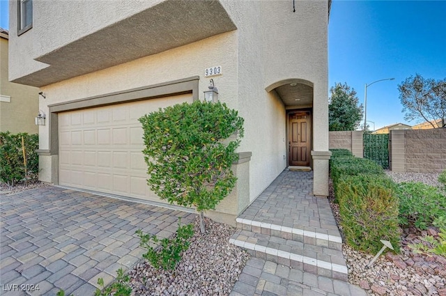 entrance to property featuring a garage