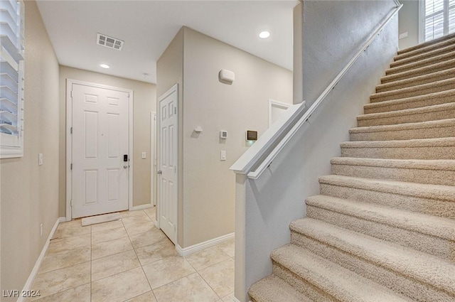9303 Ettrick Ct, Las Vegas, NV 89178 - entrance foyer featuring stairs, baseboards, light tile patterned floors, and recessed lighting