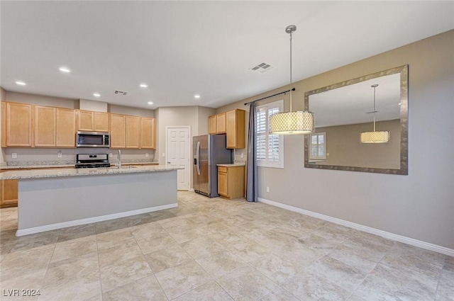 kitchen featuring light brown cabinetry, light stone countertops, hanging light fixtures, and appliances with stainless steel finishes