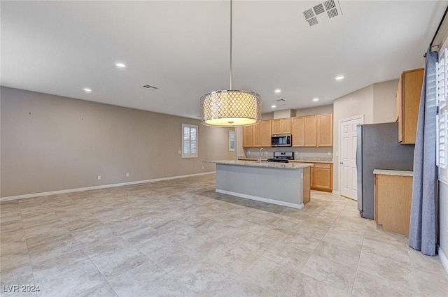 9303 Ettrick Ct, Las Vegas, NV 89178 - kitchen with appliances with stainless steel finishes, recessed lighting, a center island with sink, decorative light fixtures, and baseboards