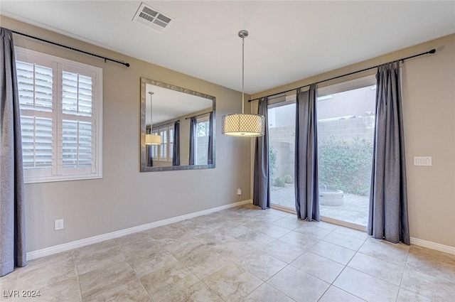 unfurnished room with light tile patterned floors