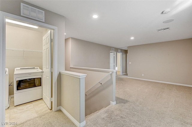 9303 Ettrick Ct, Las Vegas, NV 89178 - hallway featuring washer / dryer, an upstairs landing, light carpet, recessed lighting, and baseboards