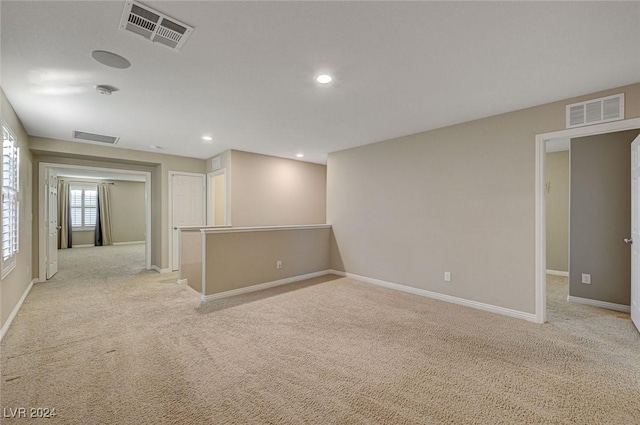 empty room with light colored carpet