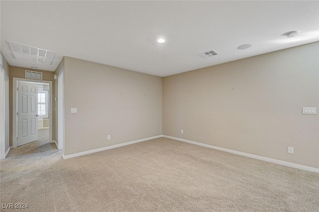 unfurnished room with light carpet