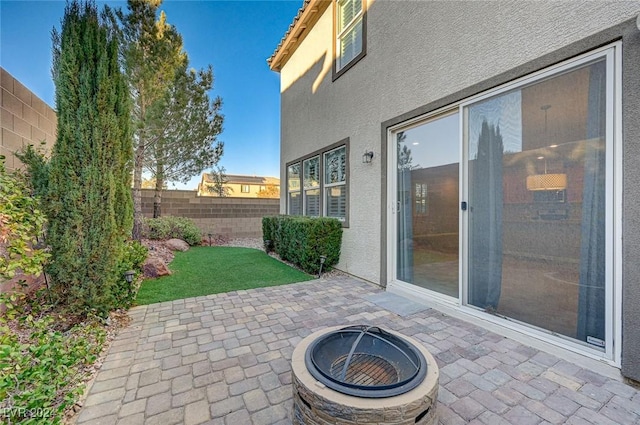 view of patio / terrace with an outdoor fire pit