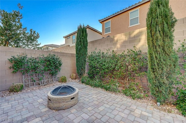 view of patio / terrace with a fire pit