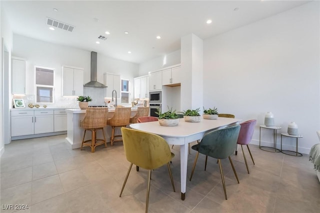 tiled dining space with sink