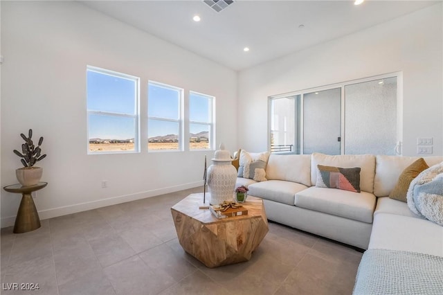 living room with light tile patterned flooring