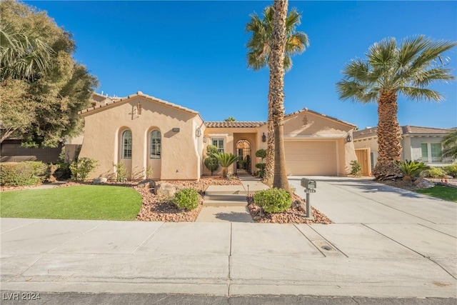 mediterranean / spanish-style house featuring a garage