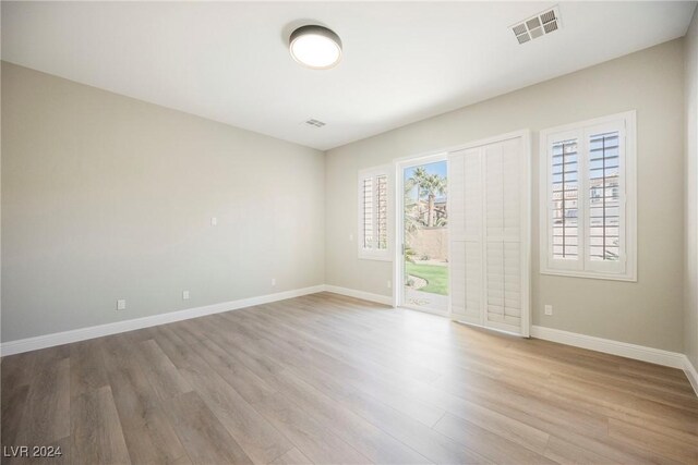 unfurnished room featuring light hardwood / wood-style flooring