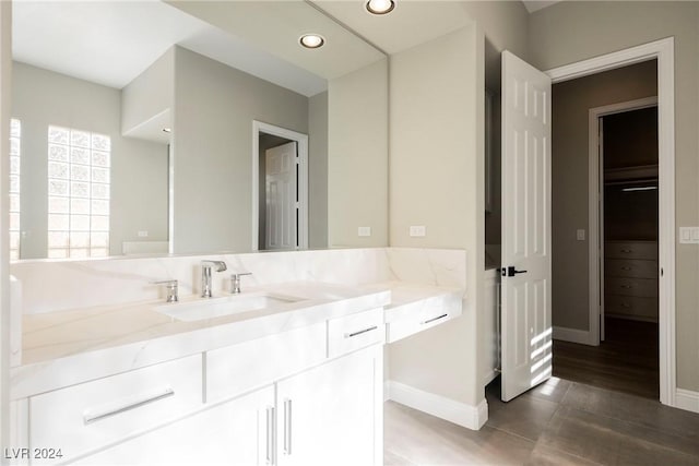 bathroom featuring hardwood / wood-style floors and vanity