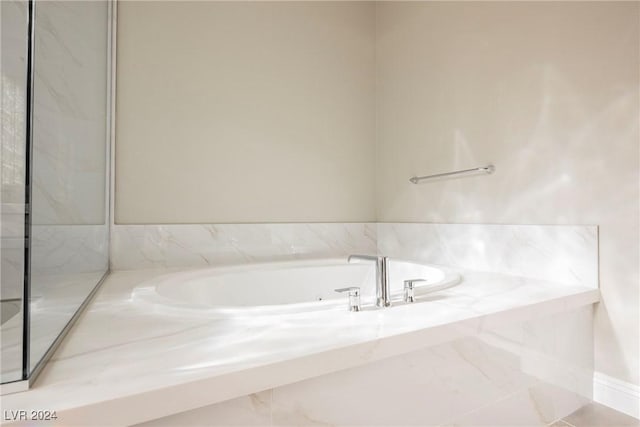 bathroom featuring a tub