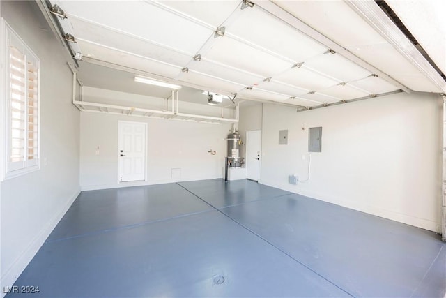 garage featuring electric panel and a garage door opener