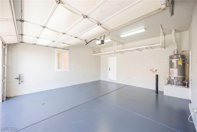 garage featuring secured water heater and a garage door opener