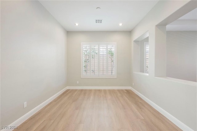 unfurnished room featuring light hardwood / wood-style floors