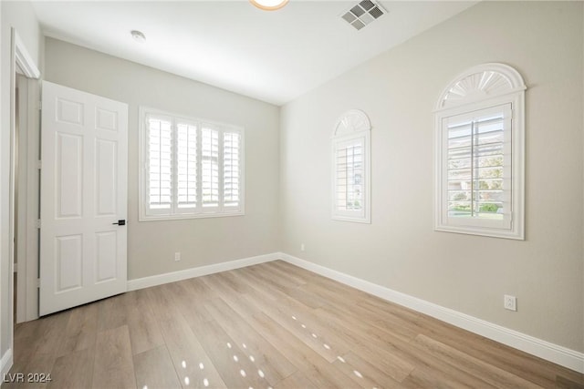 unfurnished room featuring light hardwood / wood-style flooring