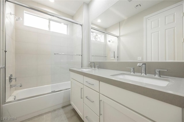 bathroom featuring vanity and enclosed tub / shower combo