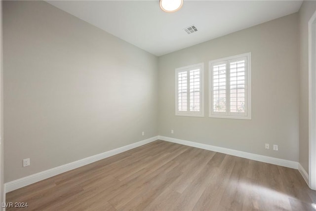 empty room with light hardwood / wood-style floors