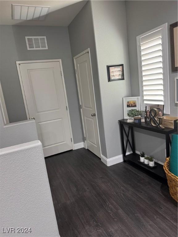 entrance foyer with dark hardwood / wood-style floors