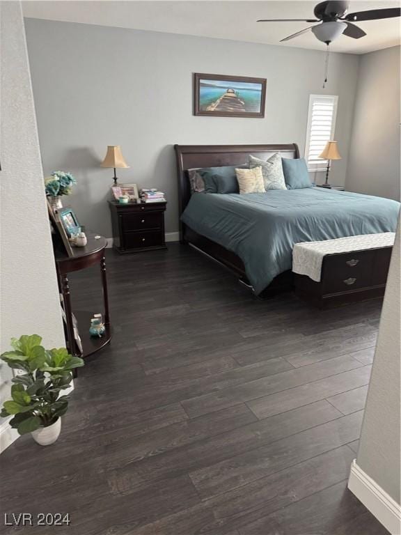 bedroom with dark wood-type flooring and ceiling fan