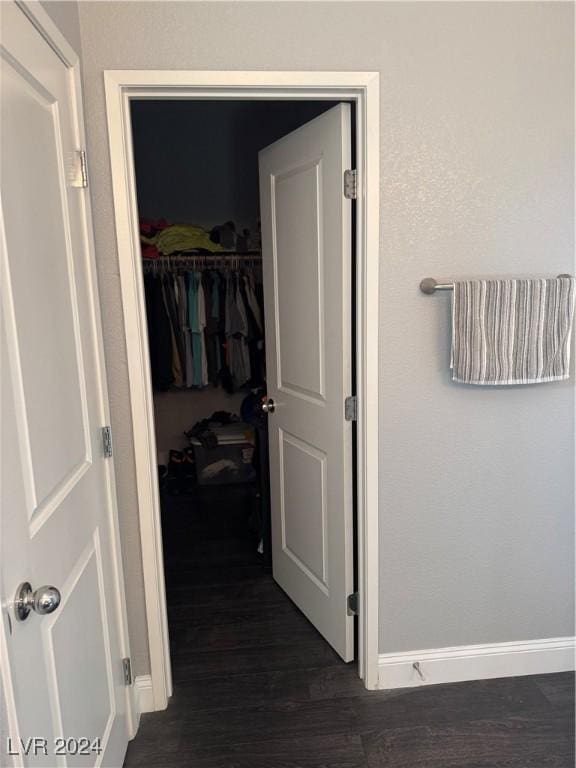 hall featuring dark wood-type flooring