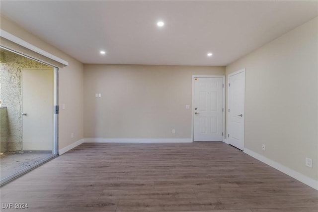 unfurnished room featuring hardwood / wood-style floors