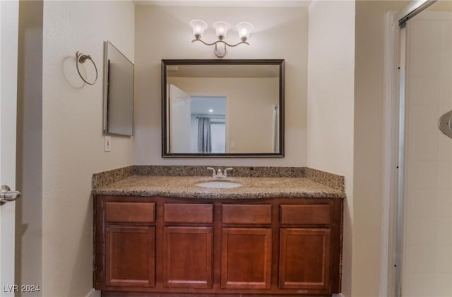 bathroom with vanity and an enclosed shower