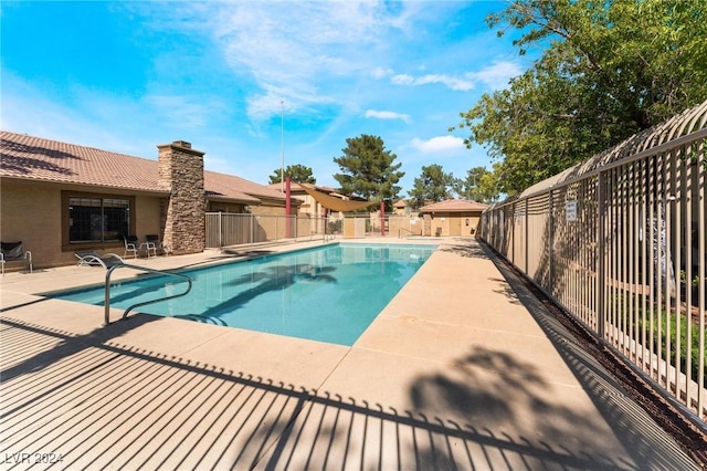 view of swimming pool featuring a patio area