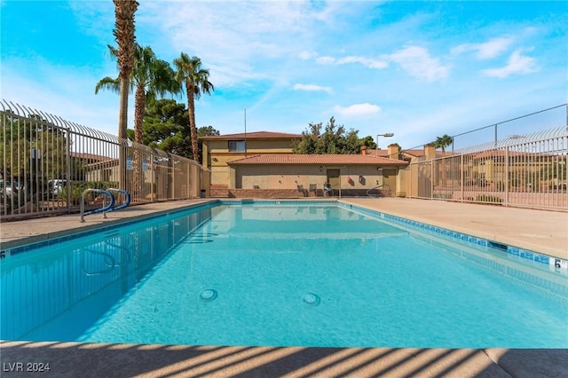 view of swimming pool featuring a patio area