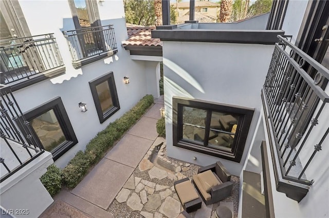 view of patio with a balcony