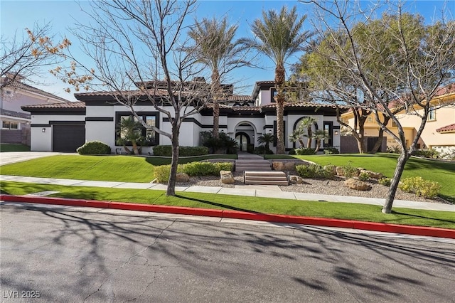 view of front of property with stucco siding, concrete driveway, an attached garage, a front yard, and a tiled roof