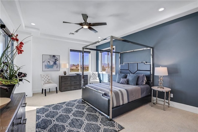 bedroom with ceiling fan and light colored carpet