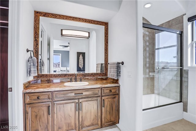 bathroom featuring shower / bath combination with glass door, ceiling fan, tile patterned floors, and vanity