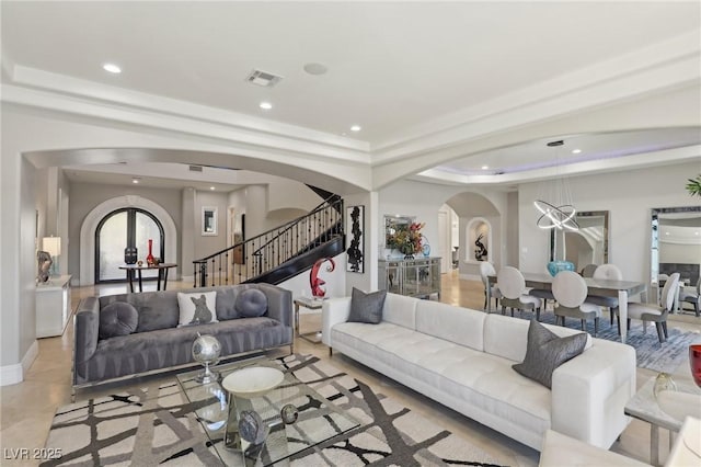 tiled living room featuring a tray ceiling