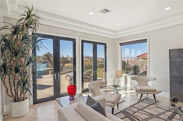 interior space with light tile patterned flooring, visible vents, recessed lighting, and french doors