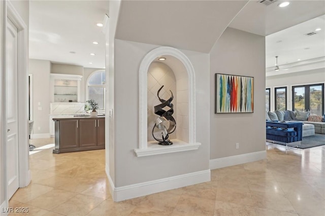 corridor featuring recessed lighting, visible vents, and baseboards