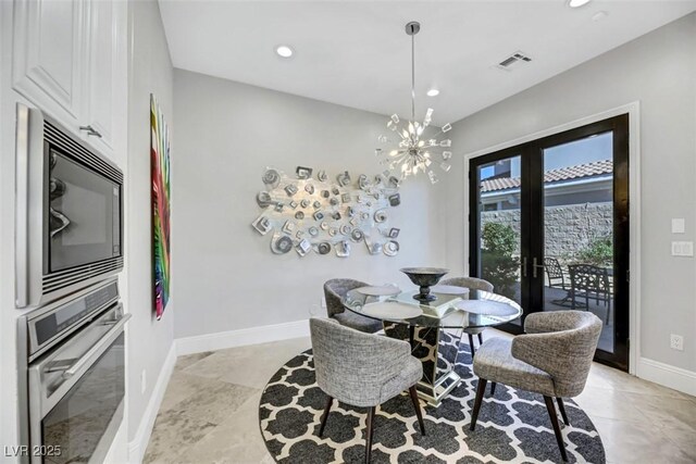 dining space featuring an inviting chandelier