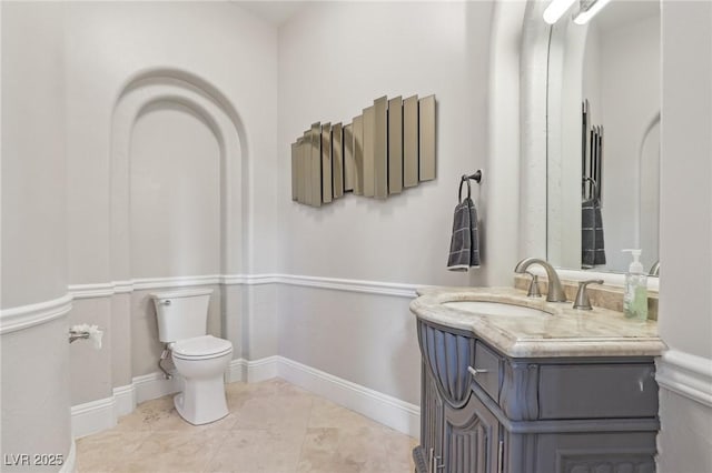 bathroom with tile patterned floors, vanity, and toilet