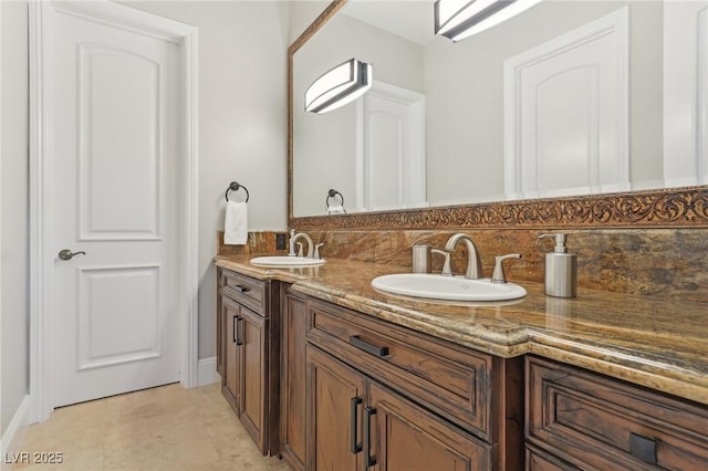 full bath featuring tile patterned flooring, double vanity, backsplash, and a sink