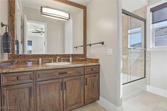 bathroom with backsplash, ceiling fan, vanity, and bath / shower combo with glass door