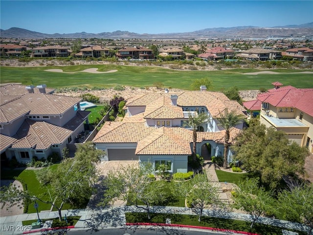 aerial view with golf course view and a residential view