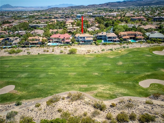 aerial view featuring golf course view, a mountain view, and a residential view