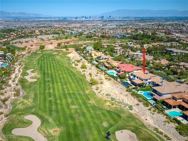 drone / aerial view featuring a mountain view and golf course view