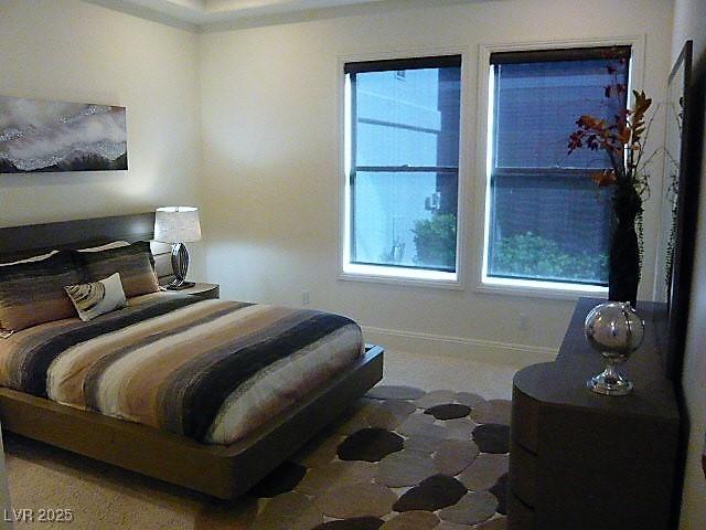 bedroom featuring baseboards