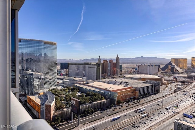 property's view of city featuring a mountain view