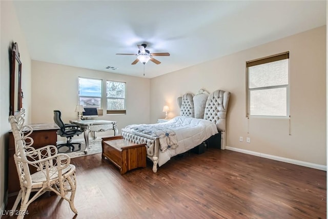 bedroom with dark hardwood / wood-style floors and ceiling fan